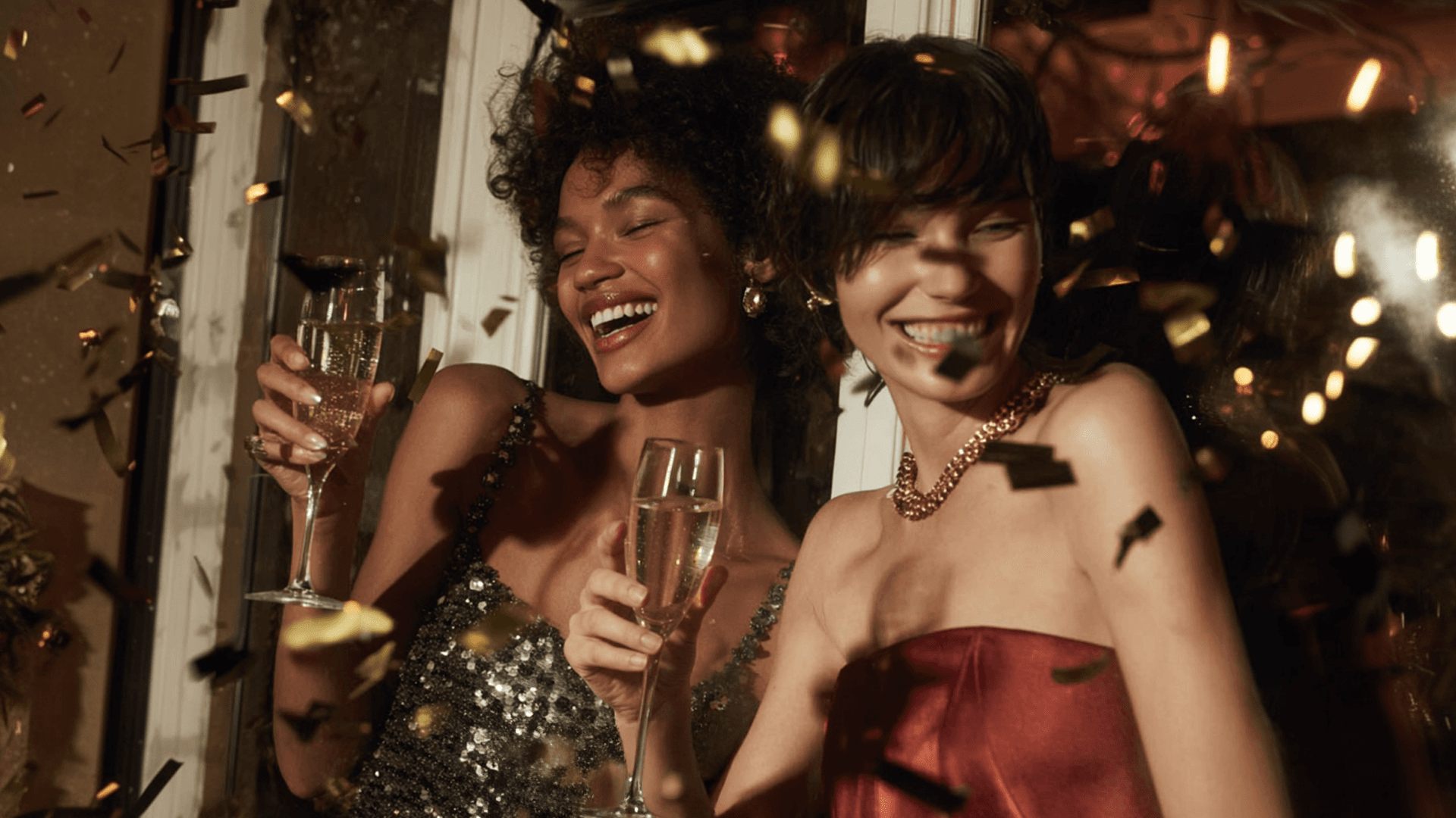 Two women celebrating with champagne